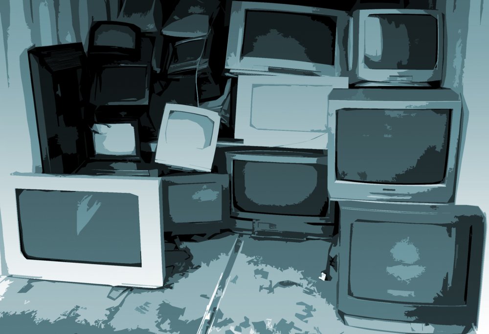 Pile of old tvs in back of truck