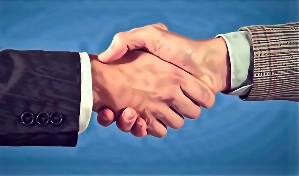 Image of two hands firmly shaking hands
